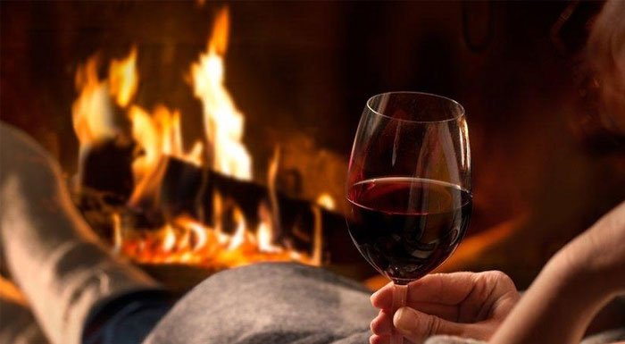 South African red wine by the fireplace